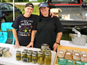 Mel selling her baked goods at the farmers market